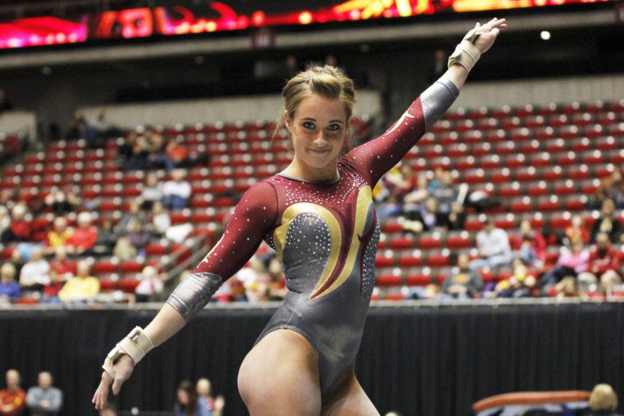 Junior Caitlin Brown competes in floor in the meet with Michigan and Illinois State on Jan. 10 at Hilton Coliseum. Brown scored a 9.875 in floor in the second place finish behind Michigan.
