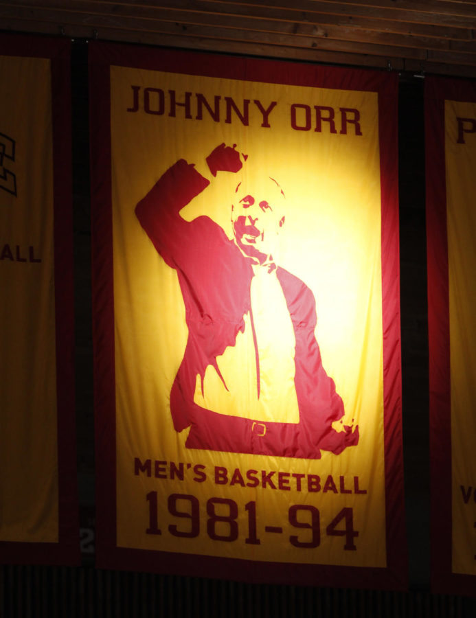 The banner for former Cyclone coach Johnny Orr was lit up for the game against Northern Illinois on Dec. 31, 2013. Orr died early that morning.