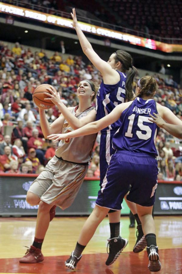 Senior forward Hallie Christofferson battles inside on her opponent during Iowa States 72-50 win over Holy Cross on Dec. 28, 2013, at Hilton Coliseum. Christofferson finished the game with 11 points and seven rebounds and two blocks.