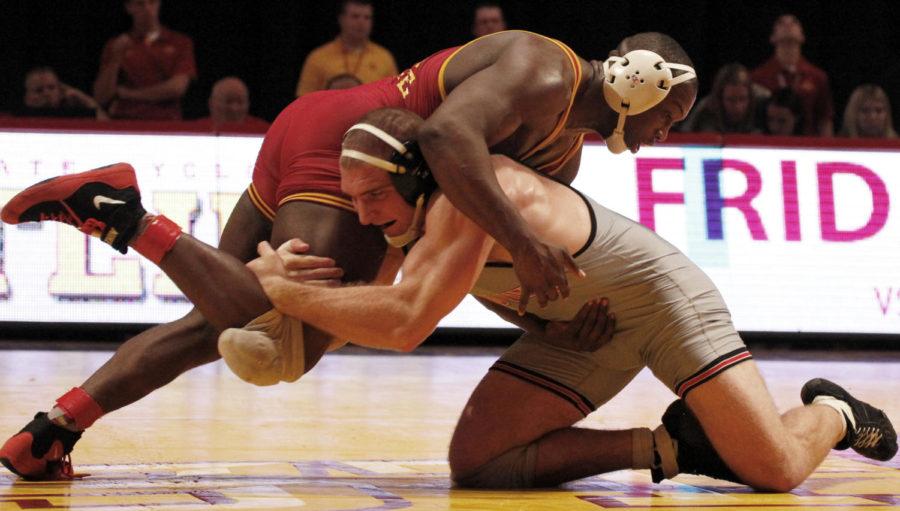 Redshirt junior Kyven Gadson wrestles against Grand Views A.J. Mott in their 197 pound matchup on Nov. 7 at Hilton Coliseum. Gadson defeated Mott 10-3 taking him down three different times. The Cyclones won their duel with Grand View 22-18.