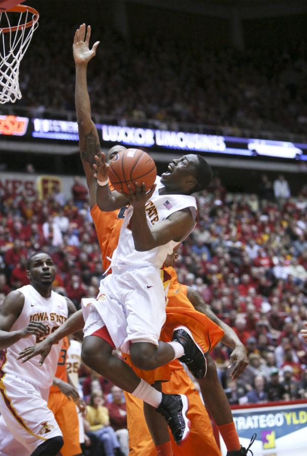 Iowa States Bubu Palo attempts a shot against Oklahoma State on Wednesday, March 6, 2013 at Hilton Coliseum. The Cyclones beat the Cowboys 87-76.
