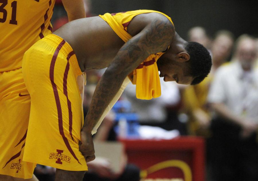 Senior guard DeAndre Kane shows exhaustion near the end of the game against Kansas on Jan. 13. The Cyclones fell to the Jayhawks 77-70. Despite injuring his ankle on Jan. 11, Kane scored 21 points against the Jayhawks on Monday.
