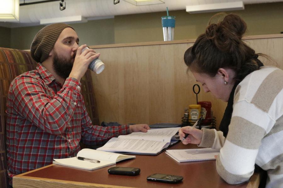 Wes Rozenboom, graduate student in psychology, and Allie Kokemiller, senior in child, adult and family services, study at Caribou Coffee with a cup of coffee Jan. 17.