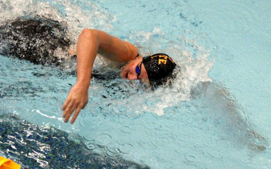 Samantha Fossum competes in the 500 M freestyle during the Cy-Hawk series swimming and diving meet on Dec. 13. The Cyclones fell to the Hawkeyes 165-135.