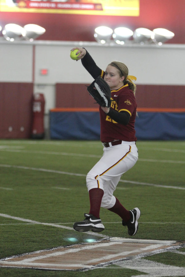 Freshman Katie Johnson winds up to pitch during the Cyclones game against South Dakota State at the Bergstrom Football Complex on Feb. 9. The Cyclones beat the Jackrabbits 4-1.
