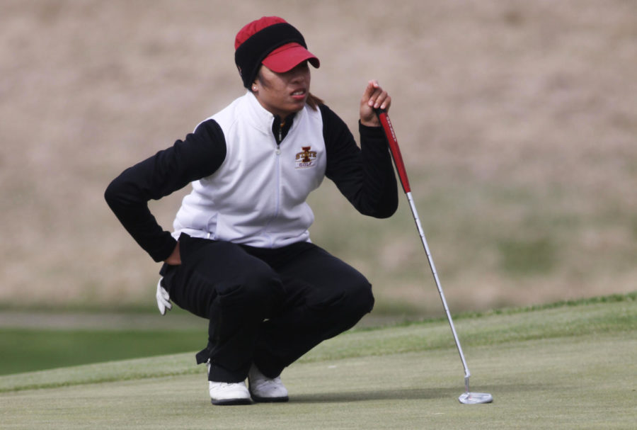 Prima Thammaraks tries to gauge the distance to the hole during the Big 12 Golf Tournament on Sunday, April 21 at The Harvester.
