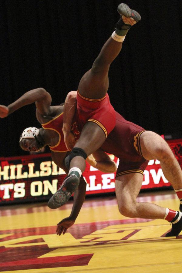 197-pound redshirt Junior Kyven Gadson is thrown by his opponent during the dual versus Minnesota at Hilton Coliseum on Feb. 23. The Cyclones fell to the Golden Gophers 12-27. Gadson took his match in a 6-4 decision.