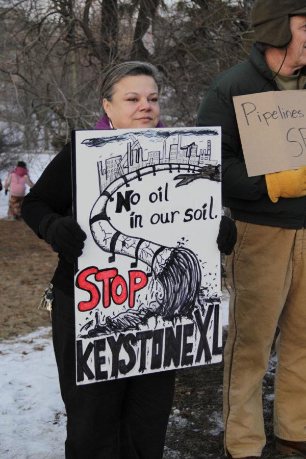 ISU students and community members protested the Keystone XL pipeline on the corner of Welch Avenue and Lincoln Way on Feb. 3, 2014. Around 30 people, including 11 students, stood in 27 degree weather for about an hour in protest of the pipeline expansion.