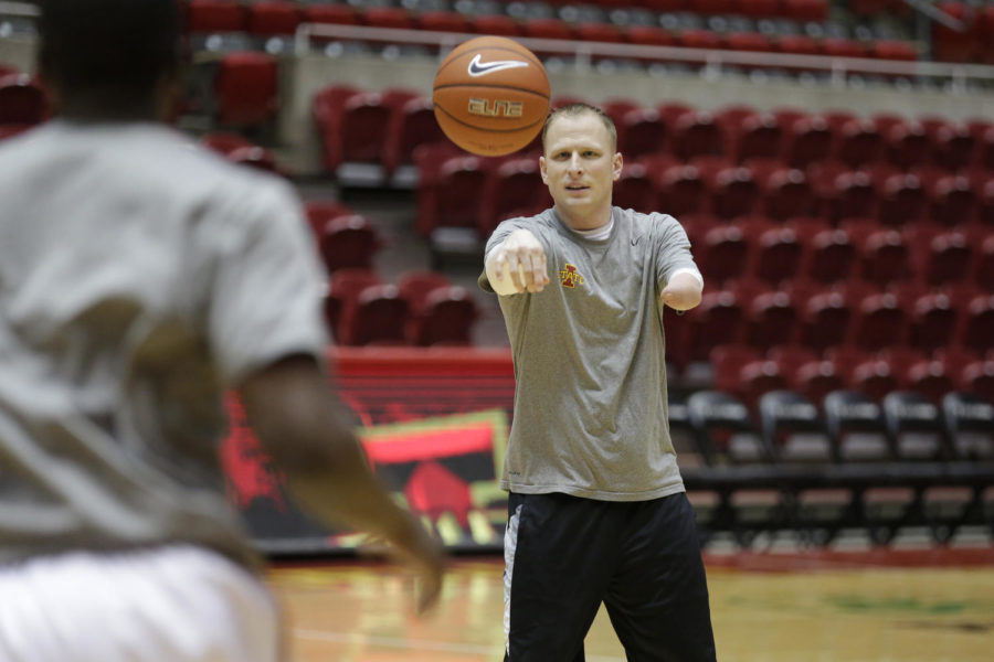 ISU graduate assistant Nate Loenser warms up ISU forwards prior to a game against No. 19 Texas on Feb. 18 at Hilton Coliseum. Loenser was born with a partial left arm and attended Iowa State, where he played baseball as a senior.