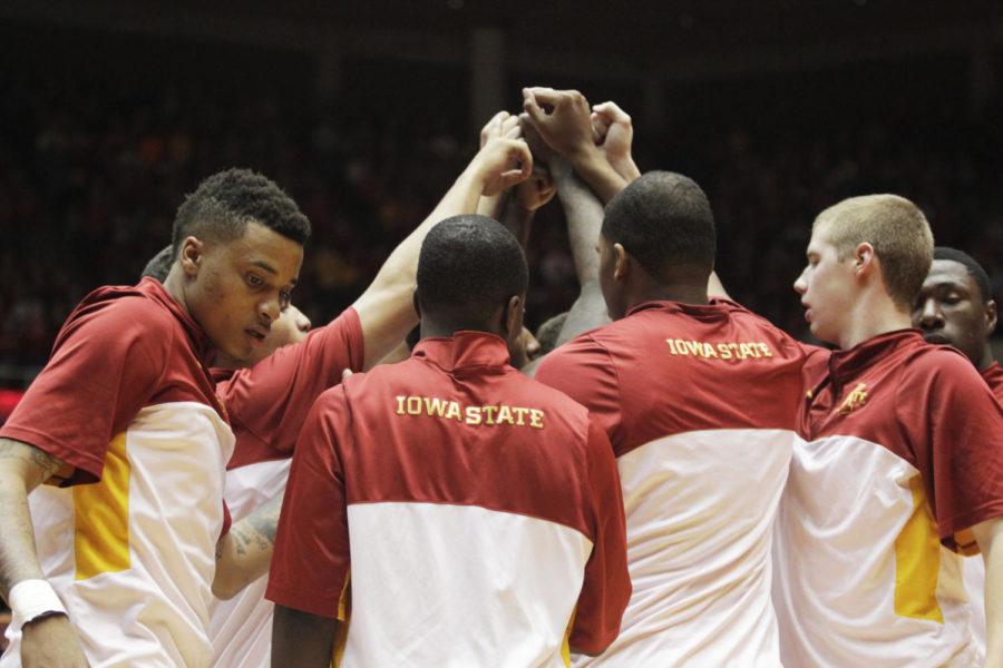 The team huddles up before the game against West Virginia on Wednesday, Feb. 26, 2014, at Hilton Coliseum. The No. 15 Cyclones defeated the Mountaineers 83-66.