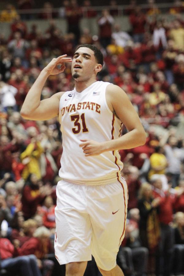 Sophomore Georges Niang celebrates a 3-point shot he scored against West Virginia on Wednesday, Feb. 26, at Hilton Coliseum. Niang had 24 points in 39 minutes of play for Iowa State. The No. 15 Cyclones defeated the Mountaineers 83-66. Iowa State is now 22-5 overall, and 10-5 in the Big 12.