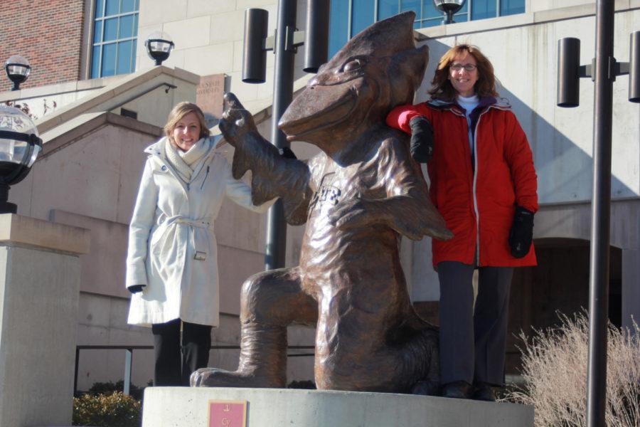 Left to Right: Makenzie Heddens and Teresa Albertson stand by the statue of Cy. The statue of Cy will be copied into different molds each with its own unique sense of art.