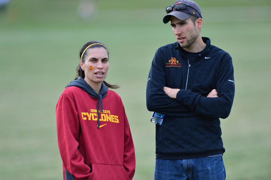 Womens distance coach Andrea Grove-McDonough talks with middle distance assistant Will Palmer.