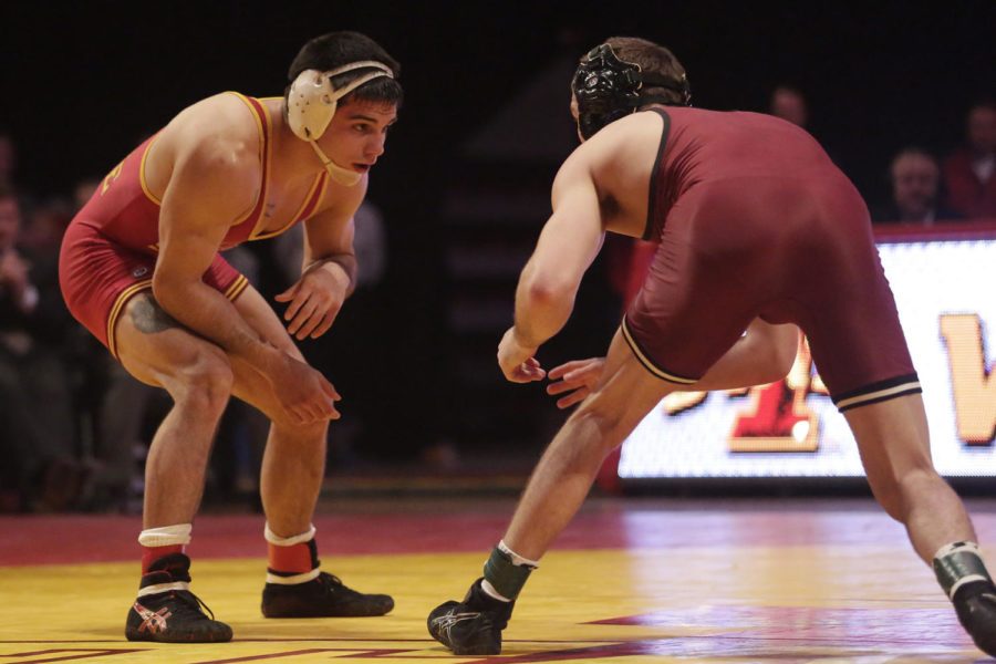 Redshirt junior Michael Moreno, 165 pounds, prepares to grapple with his opponent Jan. 12 at Hilton Coliseum. Moreno won by major decision. Iowa State lost the dual to Oklahoma, 27-11.