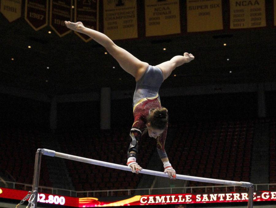 Senior Camille Santerre-Gervais competes in uneven bars in the meet with Michigan and Illinois State on Jan. 10 at Hilton Coliseum. Santerre-Gervais scored a 9.825 in the uneven bars in the Cyclones second place finish behind Michigan.
