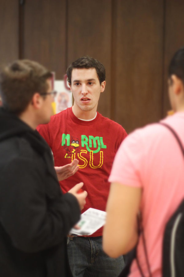 Mike Bankers, a junior in industrial engineering and management, talks with students about NORML, the Iowa State chapter.  NORML, or National Organizations for Reform of Marijuana Laws, advocates for changes concerning marijuana laws.
