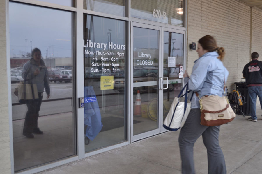 Ames resident Sarah Bruxvoort attempts to rent a DVD from the Ames Public Library to find it is closed for Feb. 19-20 due to a large number of staff having an illness. 