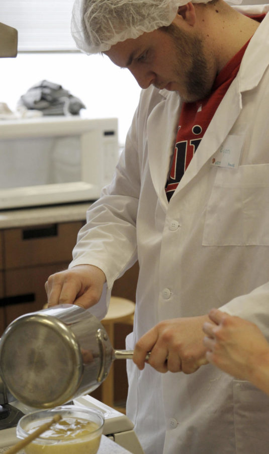 Ryan Gehlsen, sophomore in hospitality management, prepares food in Food Preparation Laboratory at MacKay Hall. The class is part of the dietician program at Iowa State that has been gaining student interest.