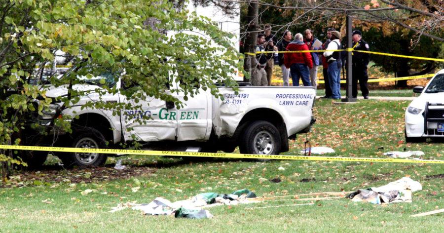 Police cordoned off a section of Central Campus as the end the police chase on Nov. 4. Witnesses reported shots fired on Central Campus. The truck involved had taken out a Homecoming sign which the remnants of lay in front of the accident. 