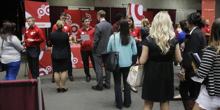 Students wait in line to speak with representatives from Target during the Business, Industry and Technology career fair on Sept. 25, 2013. 