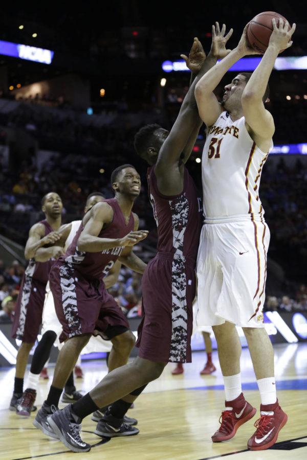 Sophomore forward Georges Niang attempts to shoot over a defender during Iowa States 93-75 over North Carolina Central in the second round of the 2014 NCAA Basketball Championship at the AT&T Center in San Antonio, TX. Niang lead the Cyclones in scoring with 24 even though he left the game with over seven minutes left with a broken foot.