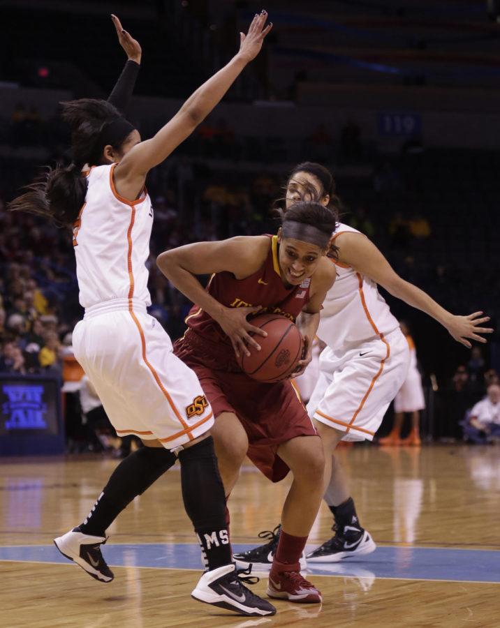 Junior guard Nikki Moody fights through Oklahoma State players on her way to the basket during Iowa States 67-57 loss to the Oklahoma State Cowgirls on March 8 at the Chesapeake Energy Arena in Oklahoma City. Moody scored 14 points for the Cyclones.