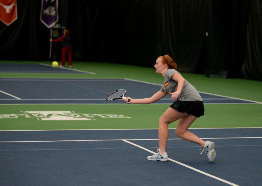 Junior Meghan Cassens hustles to the ball during Iowa States 7-0 defeat of North Dakota on Jan. 31 at Ames Racquet and Fitness Center.