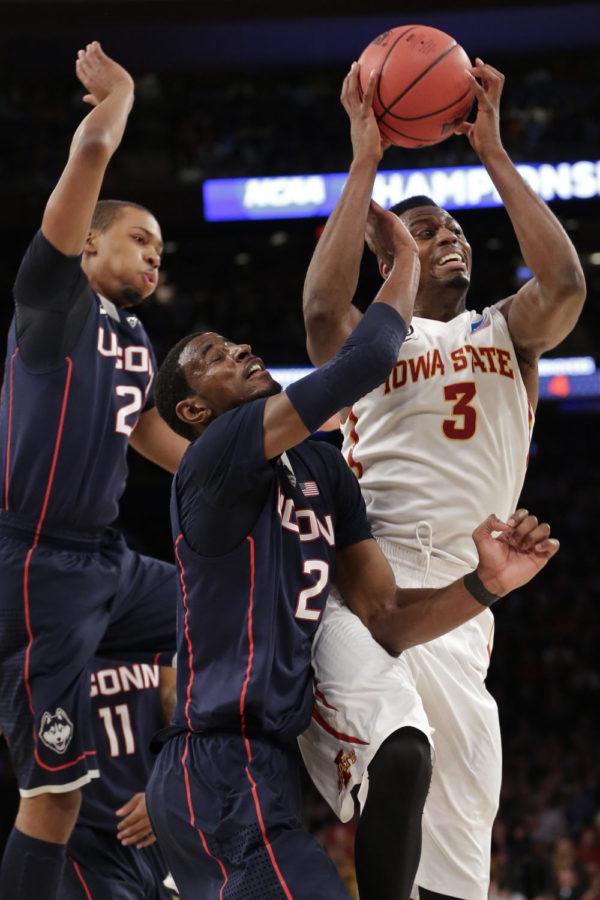 Senior forward Melvin Ejim fights off Connecticut players for a rebound during Iowa States 81-76 loss to the Huskies on March 27 at Madison Square Garden in New York City. Ejim scored seven points and had eight rebounds in his final game as a Cyclone.
