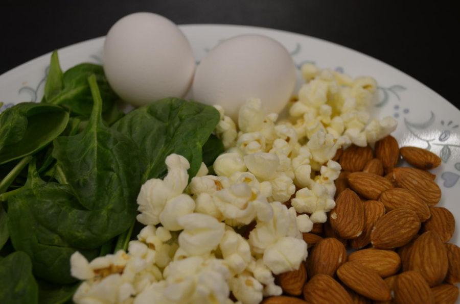 Spinach, eggs, popcorn, and almonds are all great for mid-day boost.