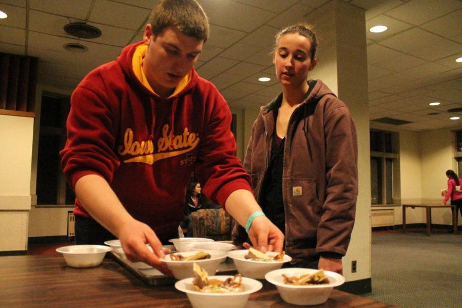 Team Candyland Crushers prepares its food items for the Iron Chef challenge of Kalideoquiz held by 88.5 KURE radio at Iowa State. Contestants had to create two dishes to serve to judges that included mystery ingredients announced over the air.
