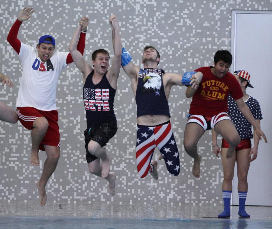 A group jumps into the pool at State Gym for the Polar Plunge on Friday, March 28 for Greek Week. The event was originally located at Lake LaVerne, but below freezing temperatures forced the plunge to move inside.