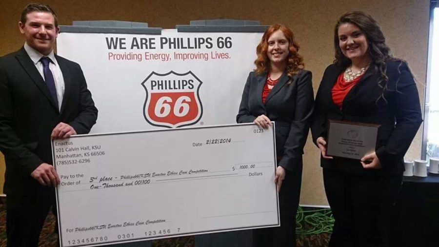 Carrie Belanger, senior in marketing, Jessica Graham, junior in management, and Sean Seymour, senior in marketing, hold their $1,000 prize from the K-State/Phillips 66 Ethics Case Competition. The team had 36 hours to develop a solution to an ethical case involving the use of social media in screening current and potential employees.