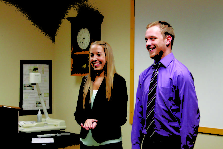Sophomore Maddy Arnold and junior Stephen Koenigsfeld react to the Iowa State Daily editor-in-chief announcements on March 27, 2014. Arnold will serve as the summer 2014 editor-in-chief, and Koenigsfeld will serve as the 2014-2015 academic year editor-in-chief. 