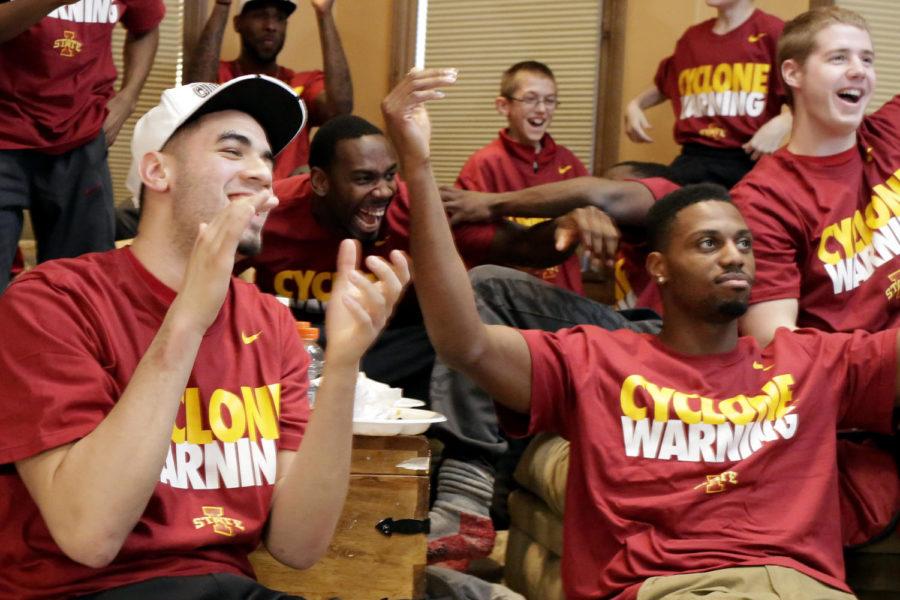 Georges Niang, left, Dustin Hogue, back center, and Melvin Ejim, right, celebrate after it was announced that Iowa State will be a third seed in the NCAA tournament. Iowa State will play March 21 in San Antonio, Texas.
