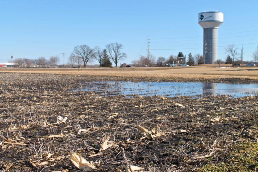 A plot of crops just south of campus, off Mortensen Parkway, sits flooded as the winter weather subsides melting tremendous amounts of snow that used to cover the area. While irrigation systems around the plots handle the majority of melted snow runoff, some water simply pools on top of the soil. 