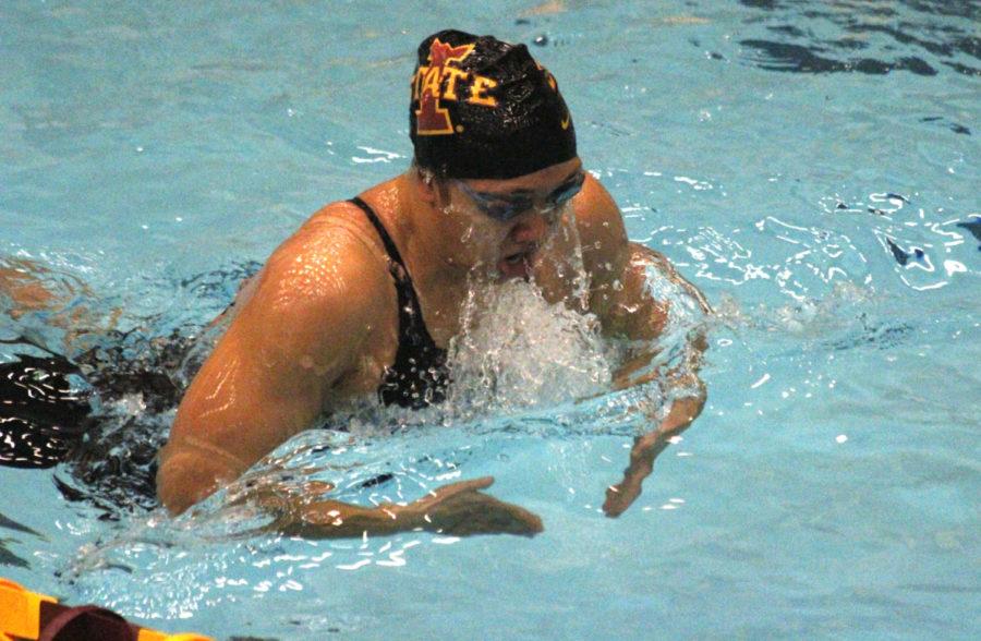 Imelda Wistey competes in the the 200 M breastroke during the Cy-Hawk swimming and diving meet on December 13. Wistey placed 1st in the 200 M breastroke, and also set a pool record in the 100M breastroke with a time of 1:00.46.