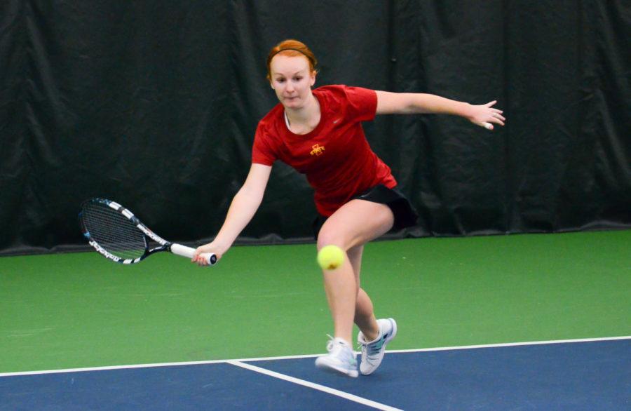Meghan Cassens, junior in marketing, hustles to the ball during Iowa States 5-2 loses to Drake on March 7 at Ames Racquet and Fitness Center.