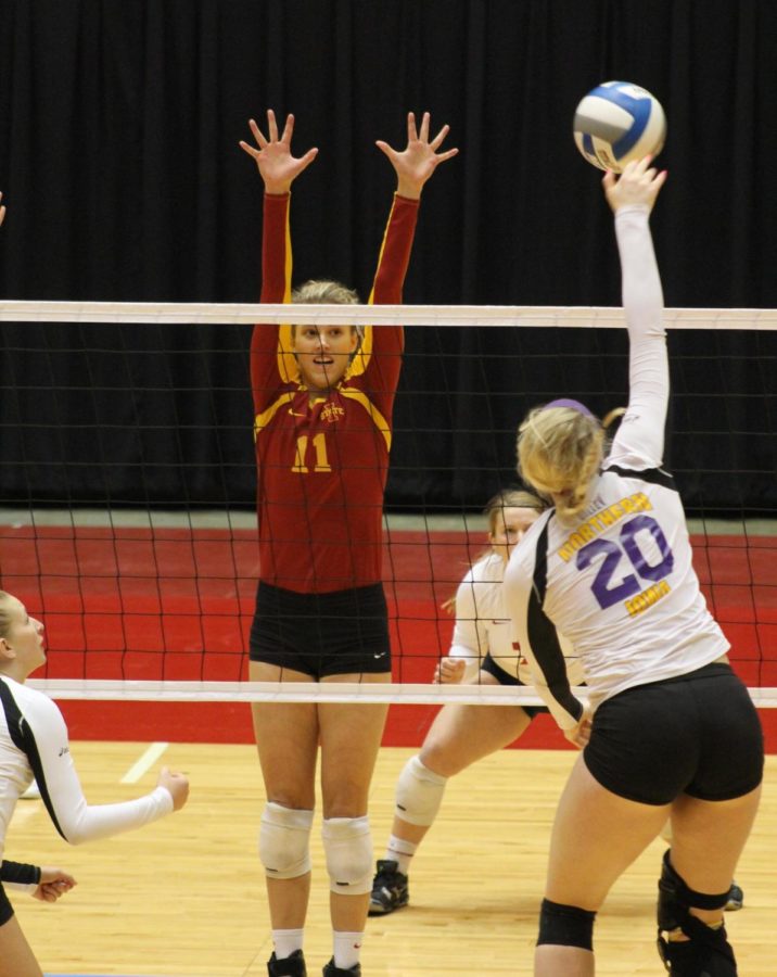 Ciara Capezio blocks a spike in the third game of the volleyball tournament on Saturday April 5th in Cy Stephens.