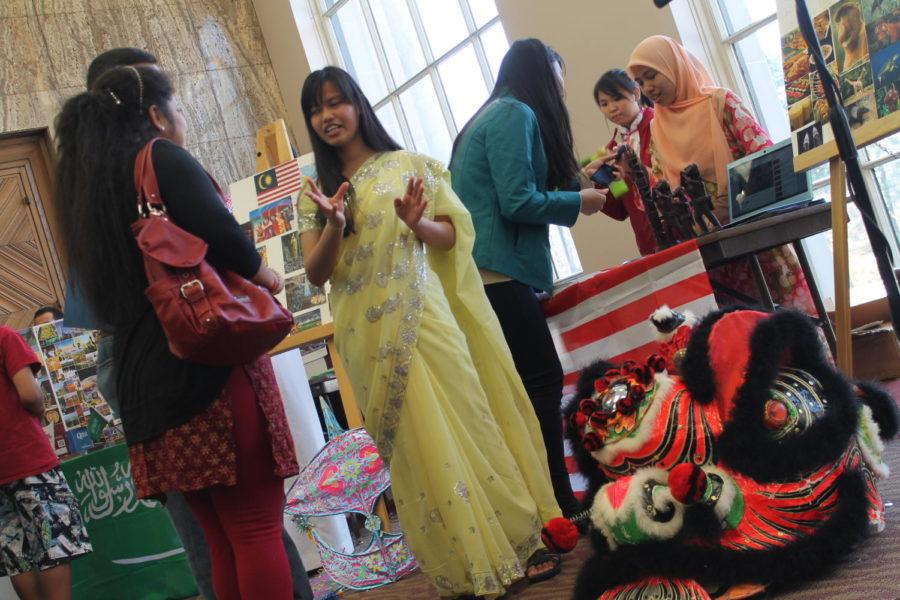 Vemala Balakrishnan, senior in dietetics, represents her Malaysian culture by speaking to guests and other international students at the International Friendship Fair on April 18 in the Memorial Union. The fair included volunteers from various geographic backgrounds who presented their culture in fun and educational way.