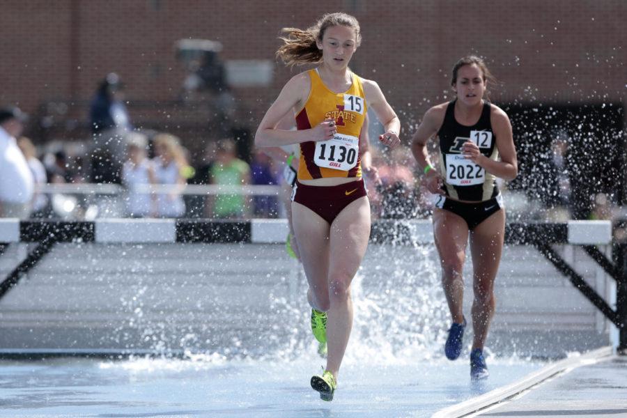 Redshirt freshman Colleen Riley runs after leaping over the steeple and splashing down into the water during the 3,000 meter steeplechase at the Drake Relays on April 26 at Drake Stadium. Riley finished with the time of 10:33.32.