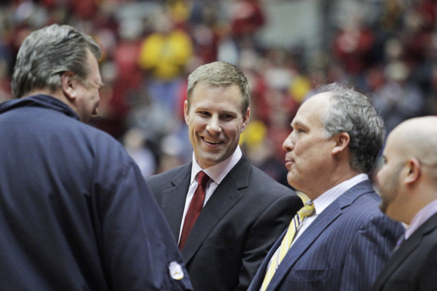 ISU coach Fred Hoiberg talks with West Virginia coach Bob Huggins and ISU assistant coaches Doc Sadler and Matt Abdelmassih before the game on Wednesday, Feb. 26, 2014, at Hilton Coliseum. The No. 15 Cyclones defeated the Mountaineers 83-66.
