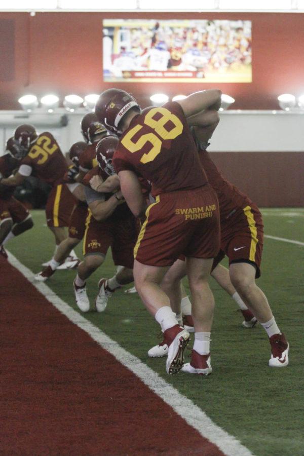 Senior defensive end Cory Morrissey practices a drill during the first spring training on March 10 at Bergstrom Football Complex. 