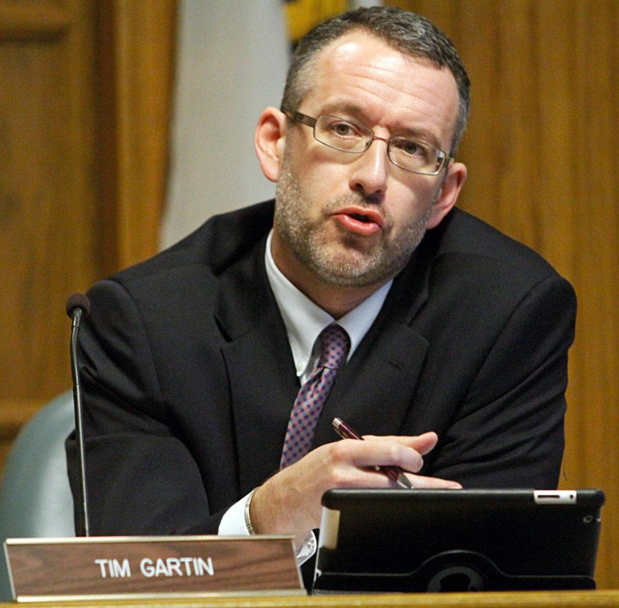 Tim Gartin, member of City Hall, debates annex laws on April 22 at City Hall in Ames.