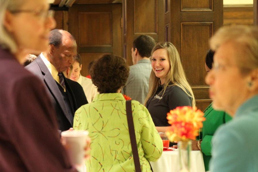 Kallen Anderson, senior in dietetics and executive board member for the Veishea committee, mingles with guests attending the opening ceremony. Several alumni and current students in attendance were presented with awards for their contributions to either the Veishea festivities or their time at Iowa State.