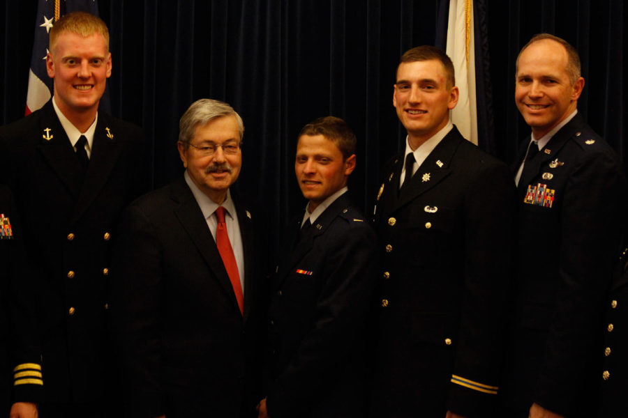 Midshipman First Class Kelly Larkin, left, Iowa Gov. Terry Branstad, Lt. Charles Hohnbaum, Cadet Lt. Col. Zachary Graham and Col. Ryan Hollman pose for a picture after the award ceremony April 9 in the Robert D. Ray Conference Room at the Capitol building. Larkin is part of the Naval ROTC, Hohnbaum is part of the Air Force ROTC and Graham is part of the Army ROTC. Hollman is the commander of the ISU Air Force ROTC and was one of three ROTC commanders at the ceremony.