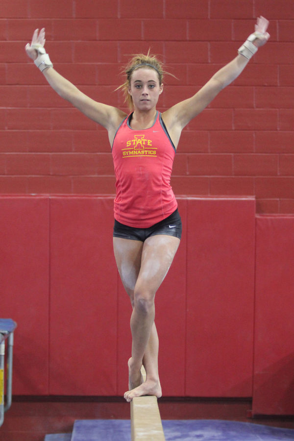 Caitlin Brown, junior from Apple Valley, Minn., practices at Beyer Halls gymnastics gym on Wednesday afternoon.