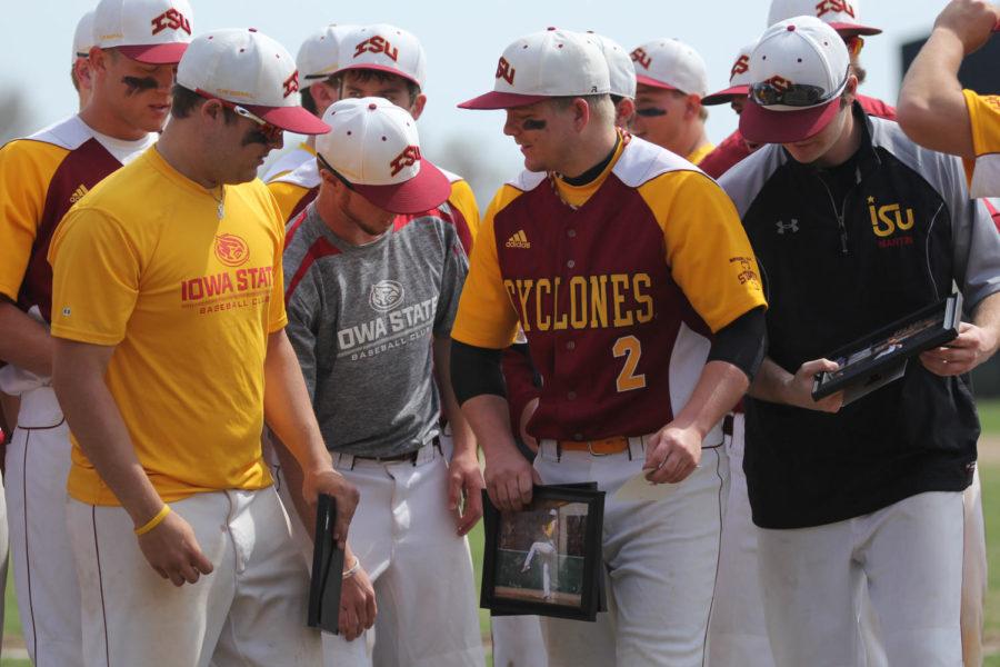 Baseball team captain and senior Ethan Schroeder interacts with teammates after receiving a senior achievement award on Saturday, April 19. 