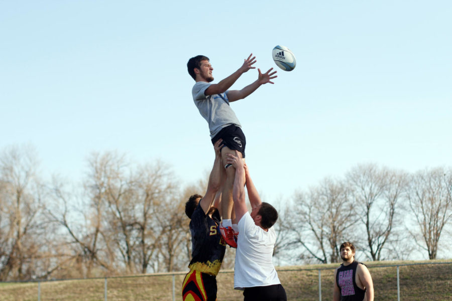 Sean Barrett catches the rugby ball during ruby teams practice on April 22 at the Southwest Athletic Complex. 