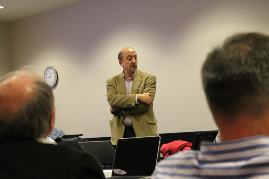 Max Rothschild, co-director for the Global Food Security Consortium, speaks in front of faculty and professors in the Seed Science Center at Iowa State. The Consortium will host a symposium on global food security on April 29 and 30. 