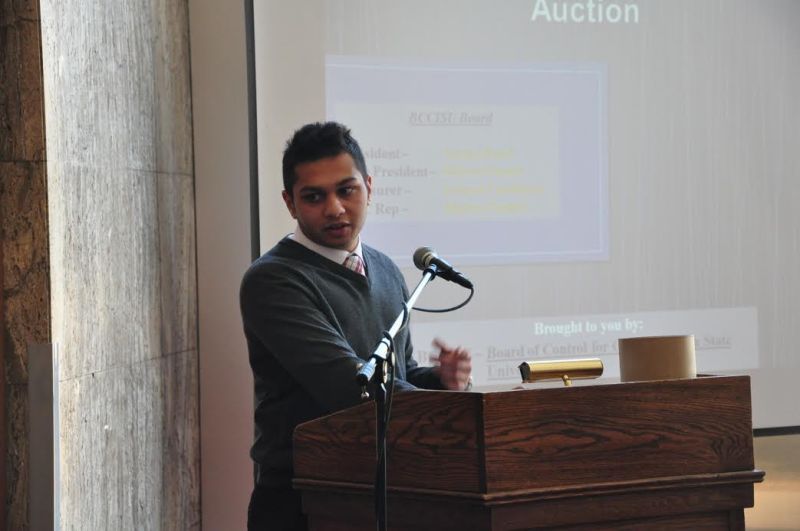 Cricket club president Sannel Patel speaks at the Cricket Club auction on March 29. 